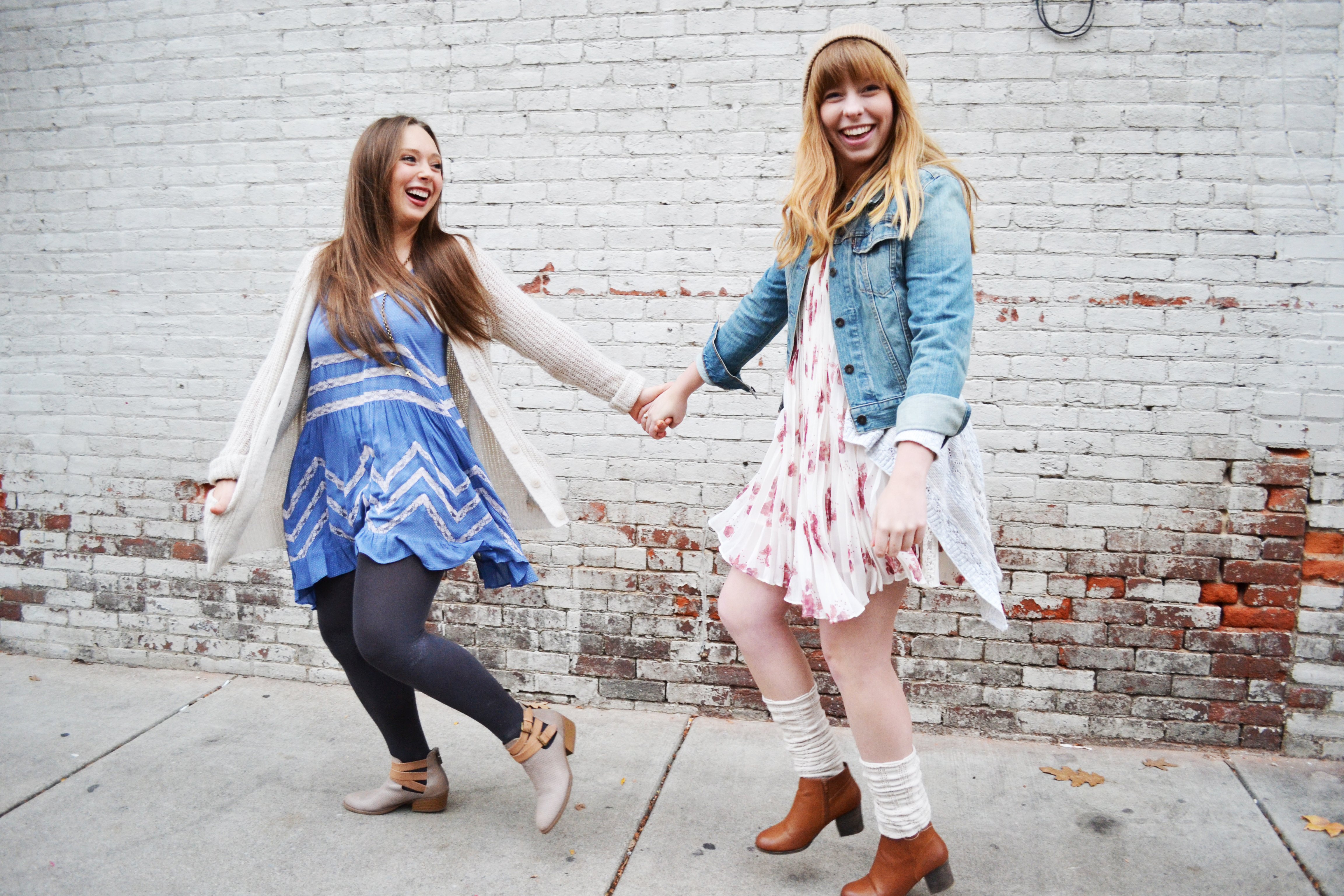 Firends Holding Hands And White Brick Wall 1