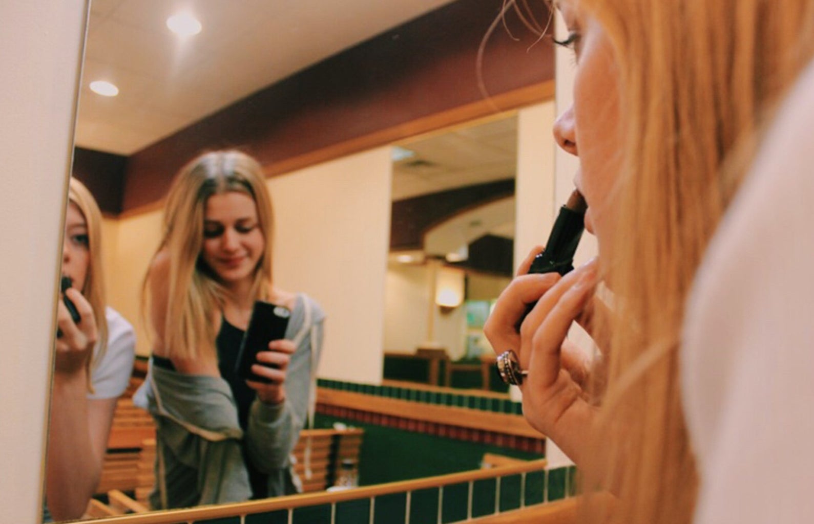Anna Schultz-Friends Putting Make Up In Front Of Mirror