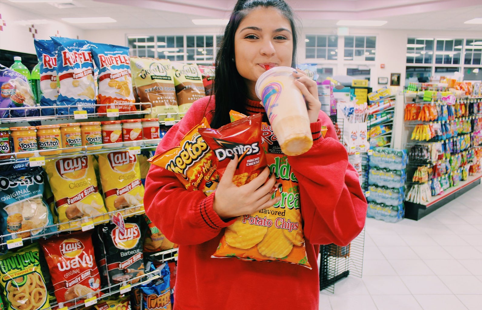 Anna Schultz-Girl With Arms Full At Gas Station