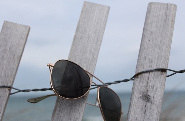 The Lalaaviator Glasses On A Fence