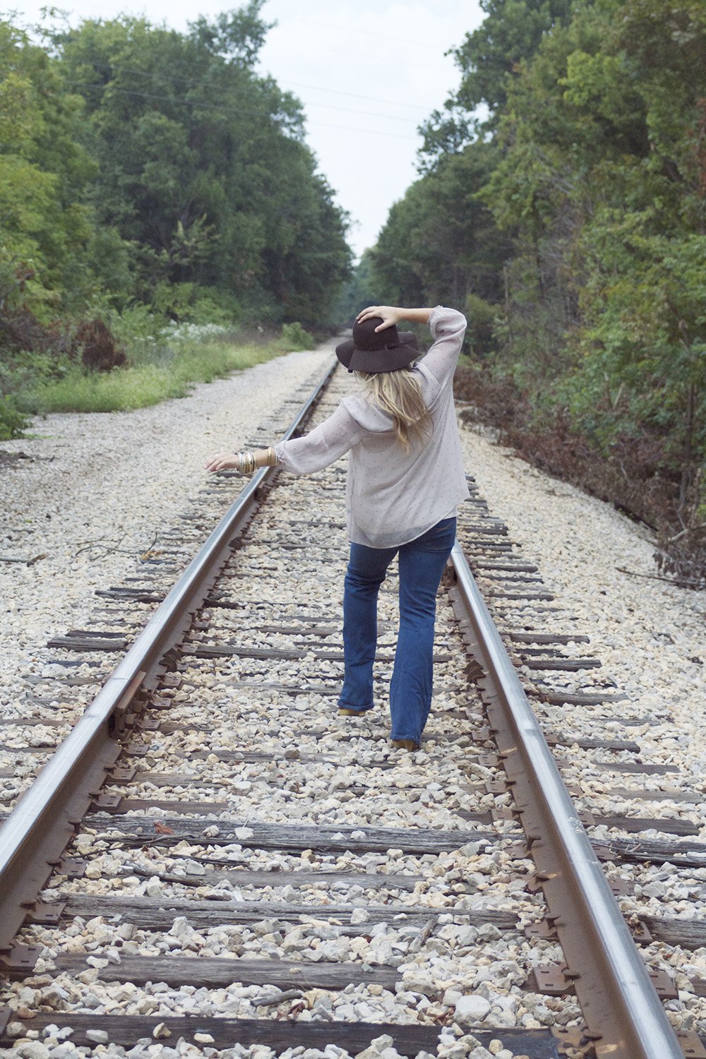 the lala girl walking down train tracks?width=698&height=466&fit=crop&auto=webp&dpr=4