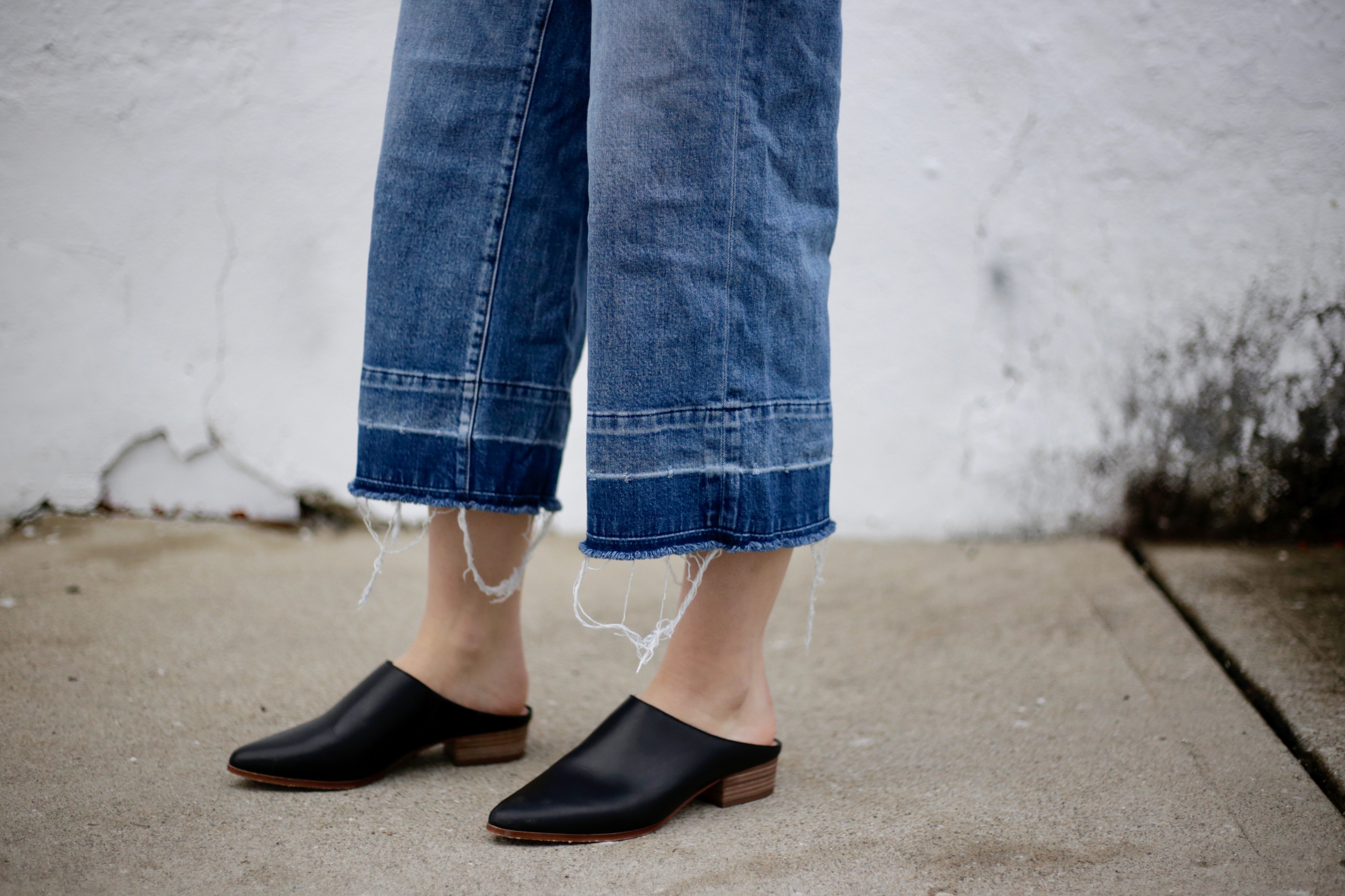 Dimi Boutselis frayed jeans fashion shoes denim white wall?width=698&height=466&fit=crop&auto=webp&dpr=4