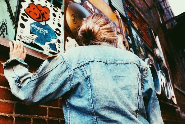 Amelia Kramer jean jacket bricks sock bun mural angle?width=698&height=466&fit=crop&auto=webp&dpr=4
