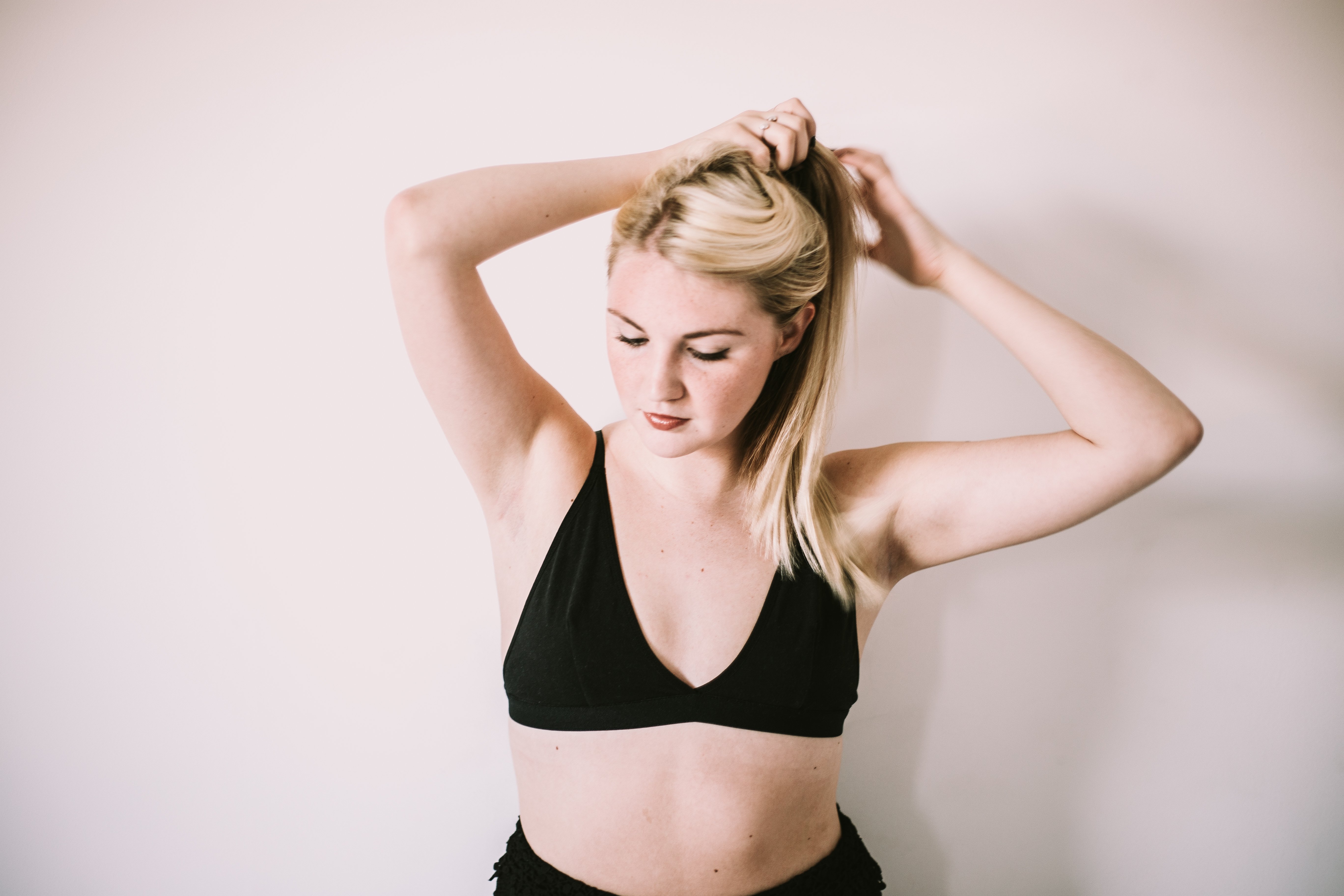 Arianna Tucker-Girl Putting Hair In Ponytail