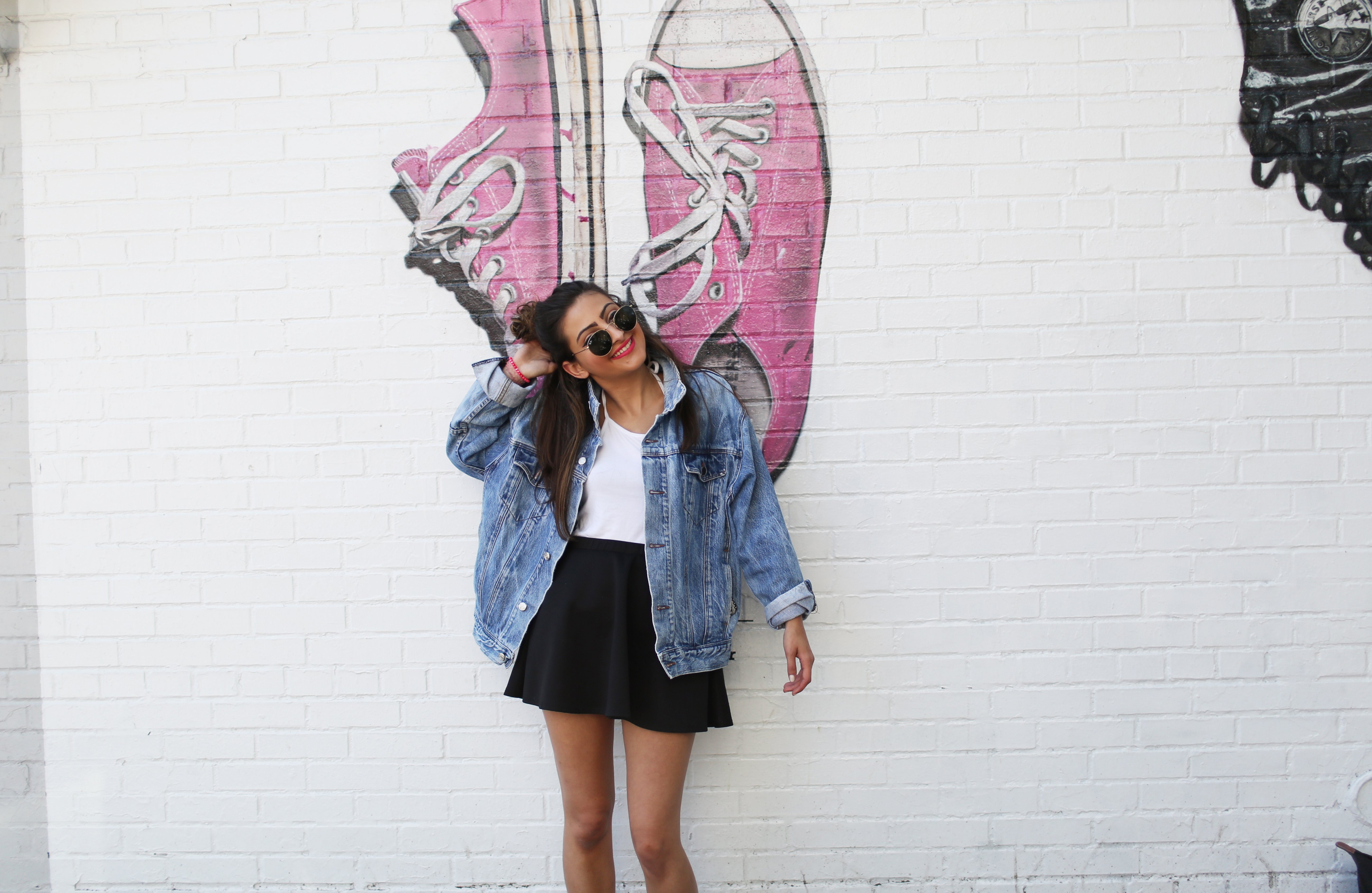 the lala girl in jean jacket in front of mural?width=698&height=466&fit=crop&auto=webp&dpr=4
