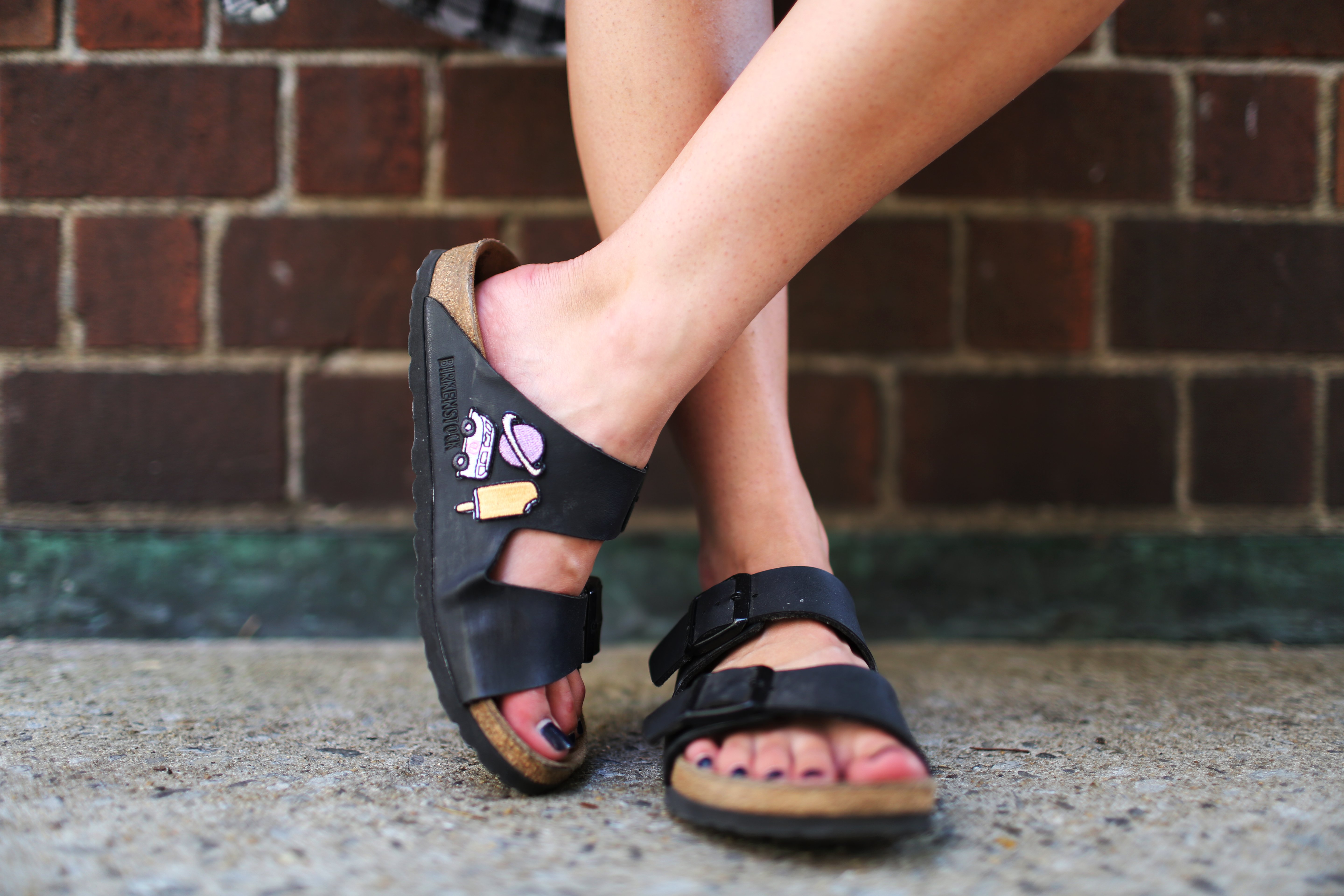 the lala birkenstocks brick wall?width=698&height=466&fit=crop&auto=webp&dpr=4