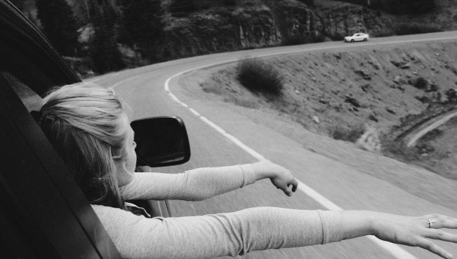 Anna Schultz-Girl On Road Trip Hands Out Window B&W
