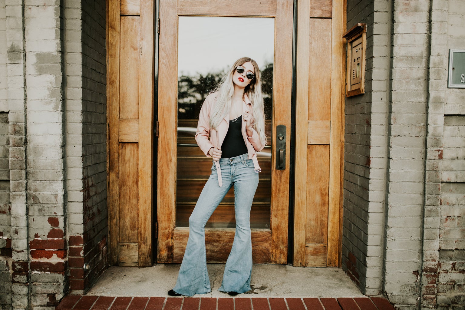 Stylish Girl In Front Of Door Way