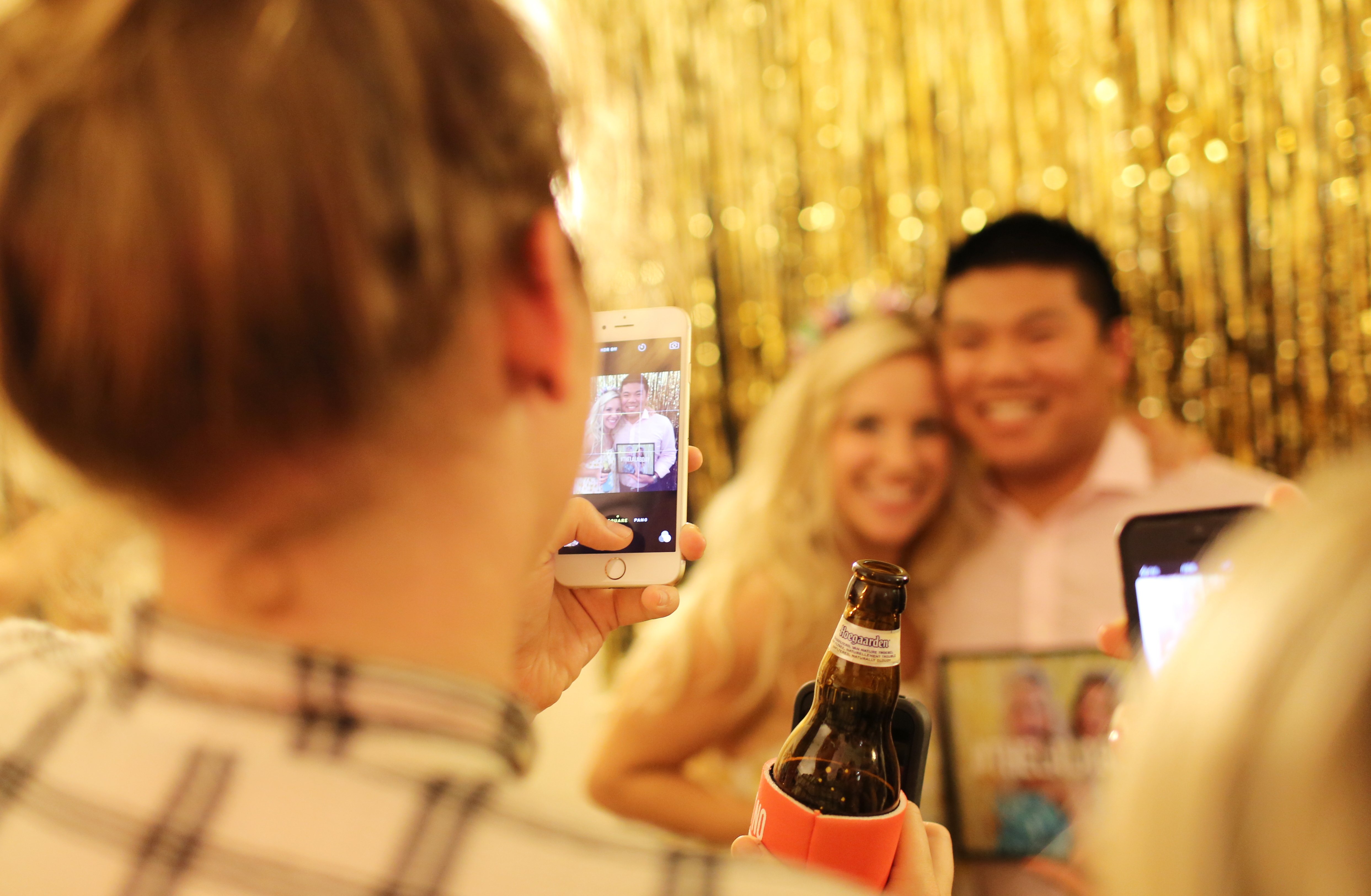 The Lalagirl Taking A Photo Of Friends With An Iphone