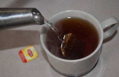 Hot Tea Pouring Water