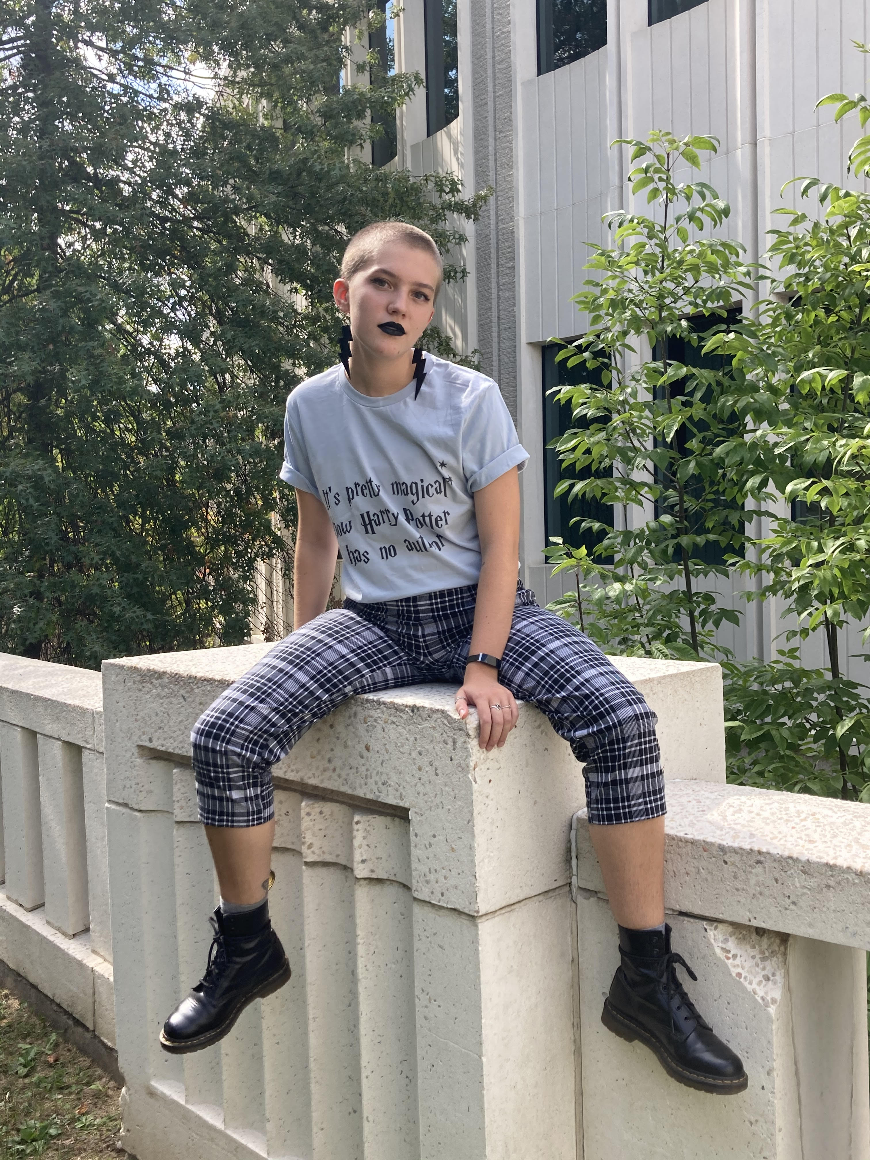 Image of a girl (me) sitting on a wall