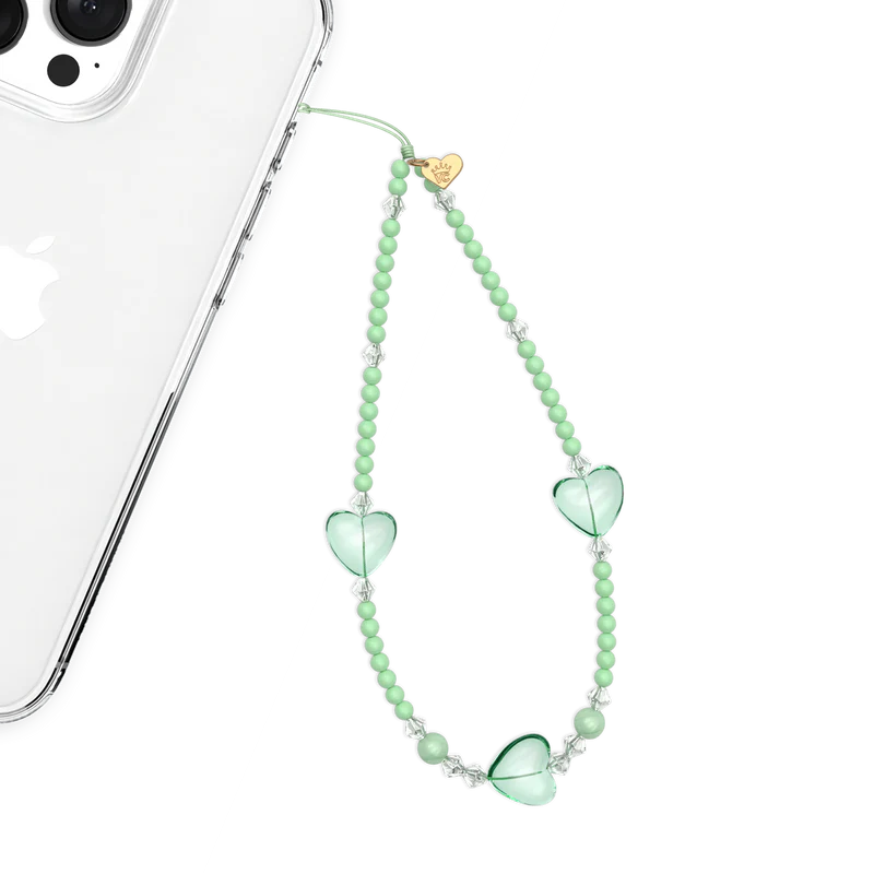 green phone charm with hearts