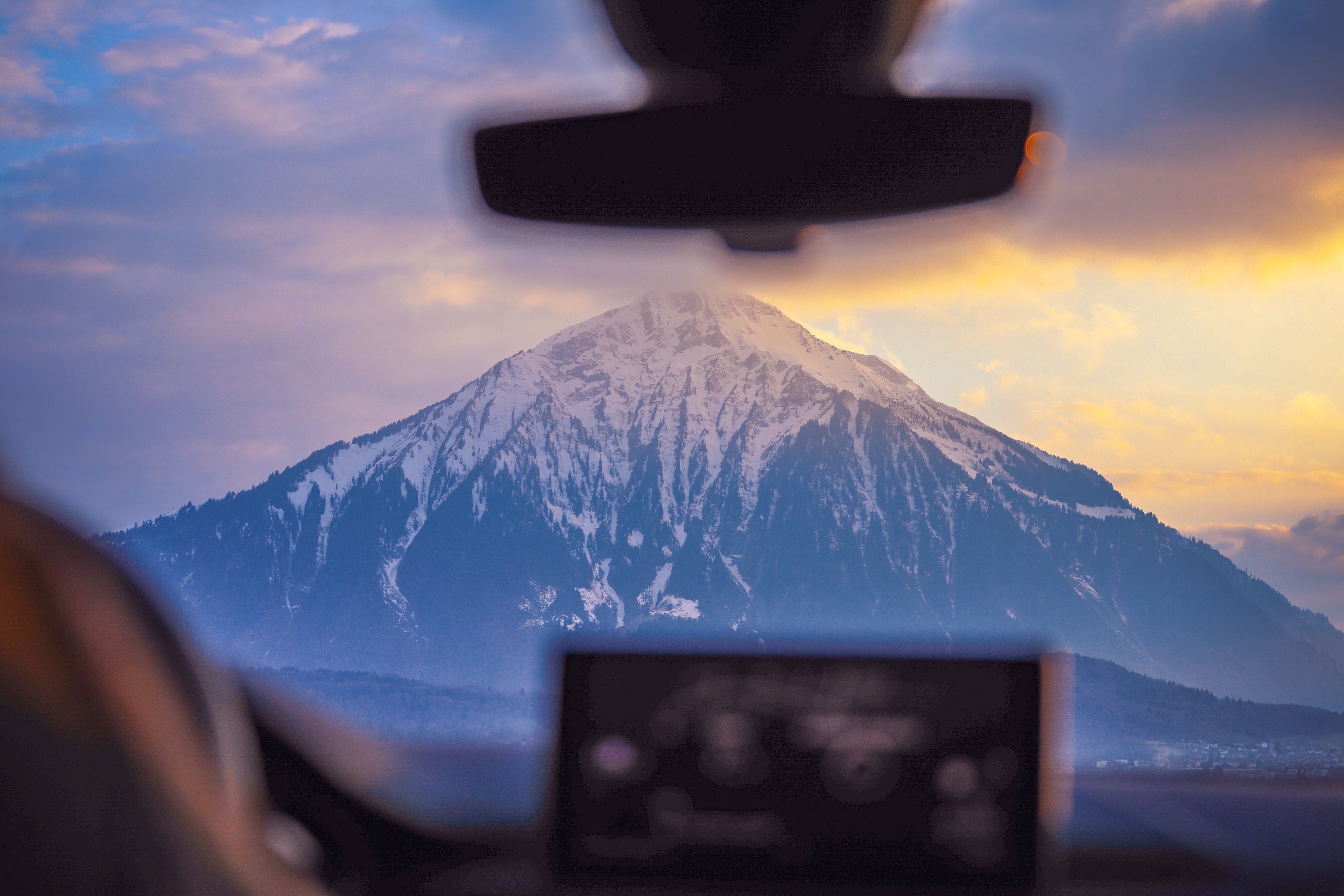 Photo Of Snow Capped Mountain Through Windshield 2404956?width=698&height=466&fit=crop&auto=webp&dpr=4