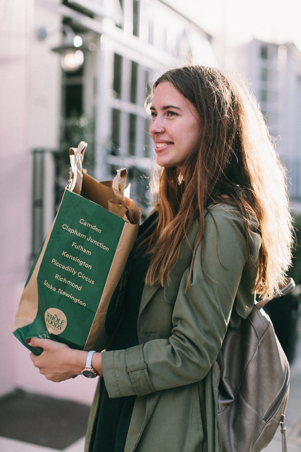 woman holding grocery bag whole foods