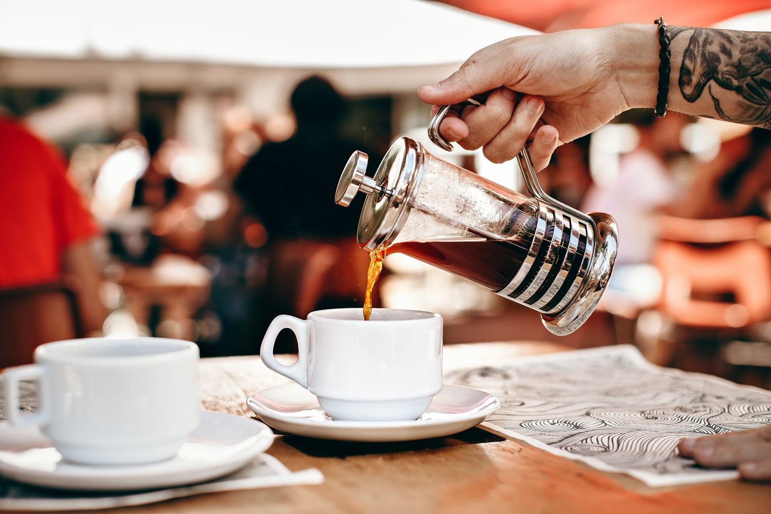 person pouring coffee