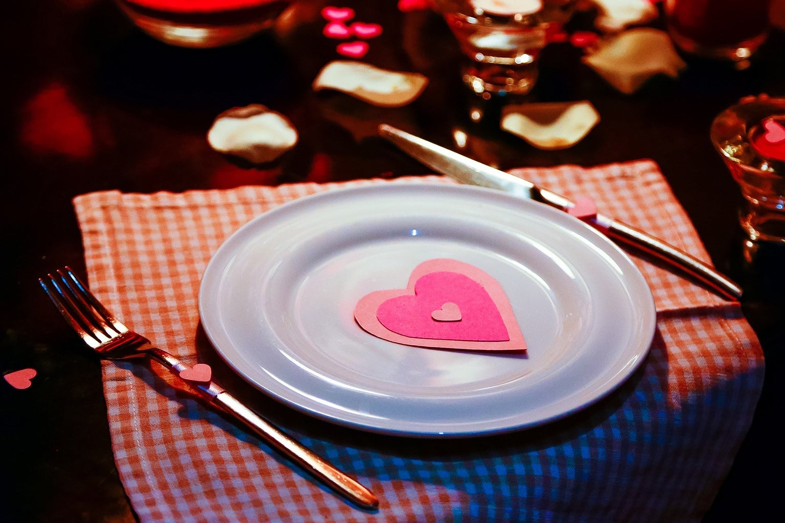 Plate with Valentine\'s Day decorations on it, on a nice table