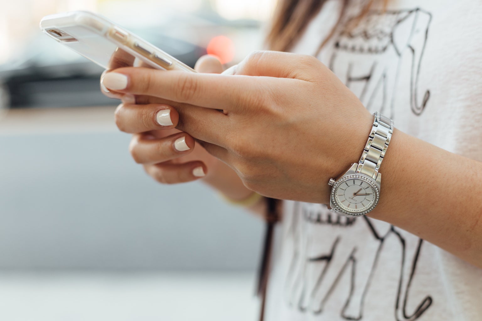 person holding iphone outside