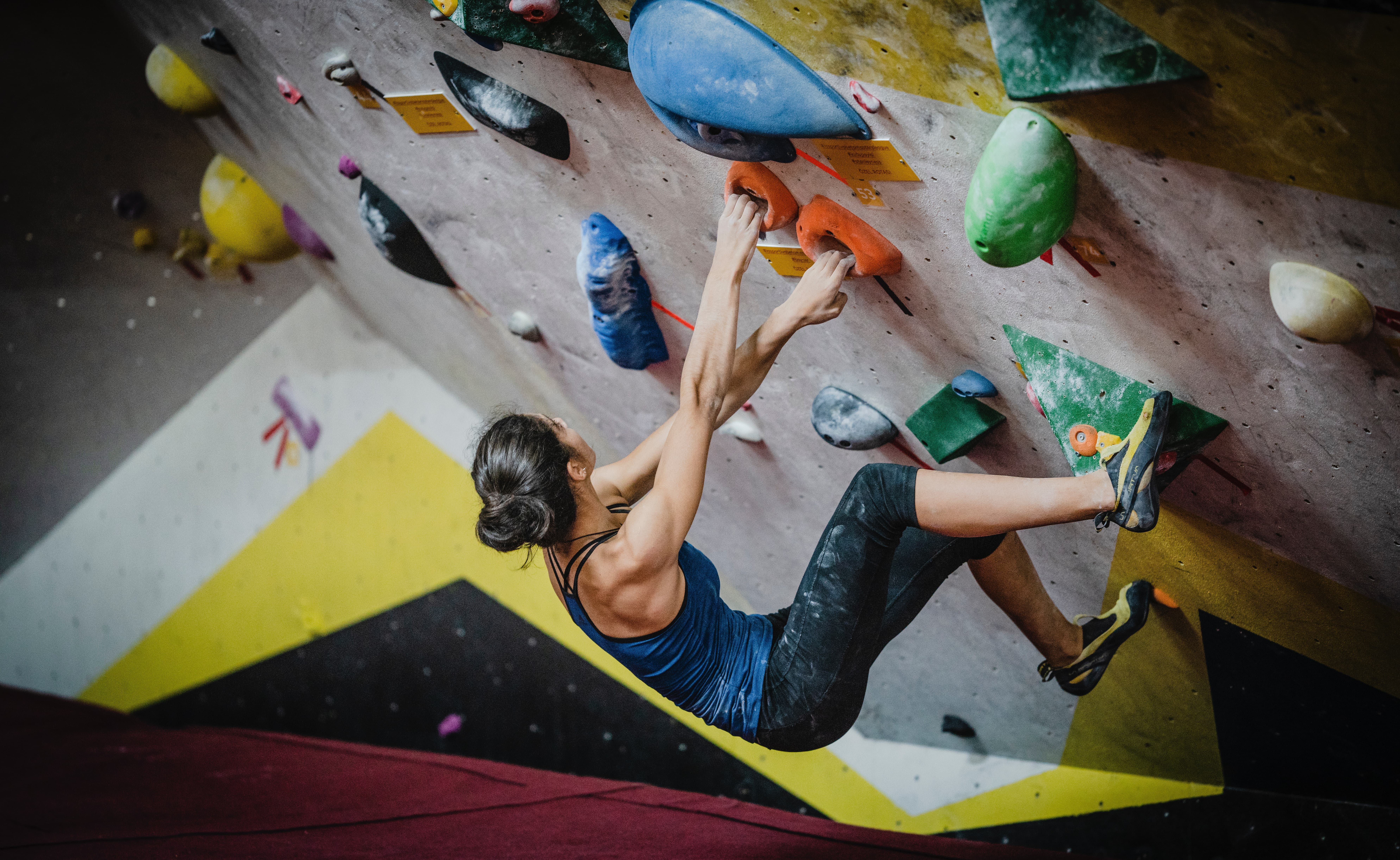 woman on rock climbing wall