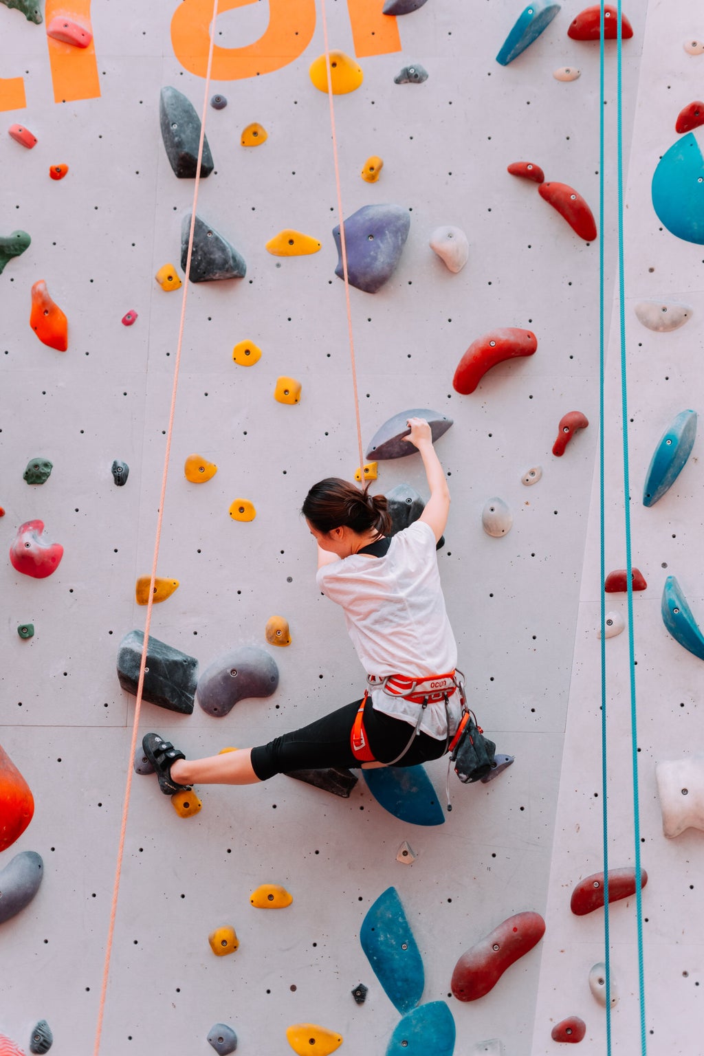 woman on rock climbing wall