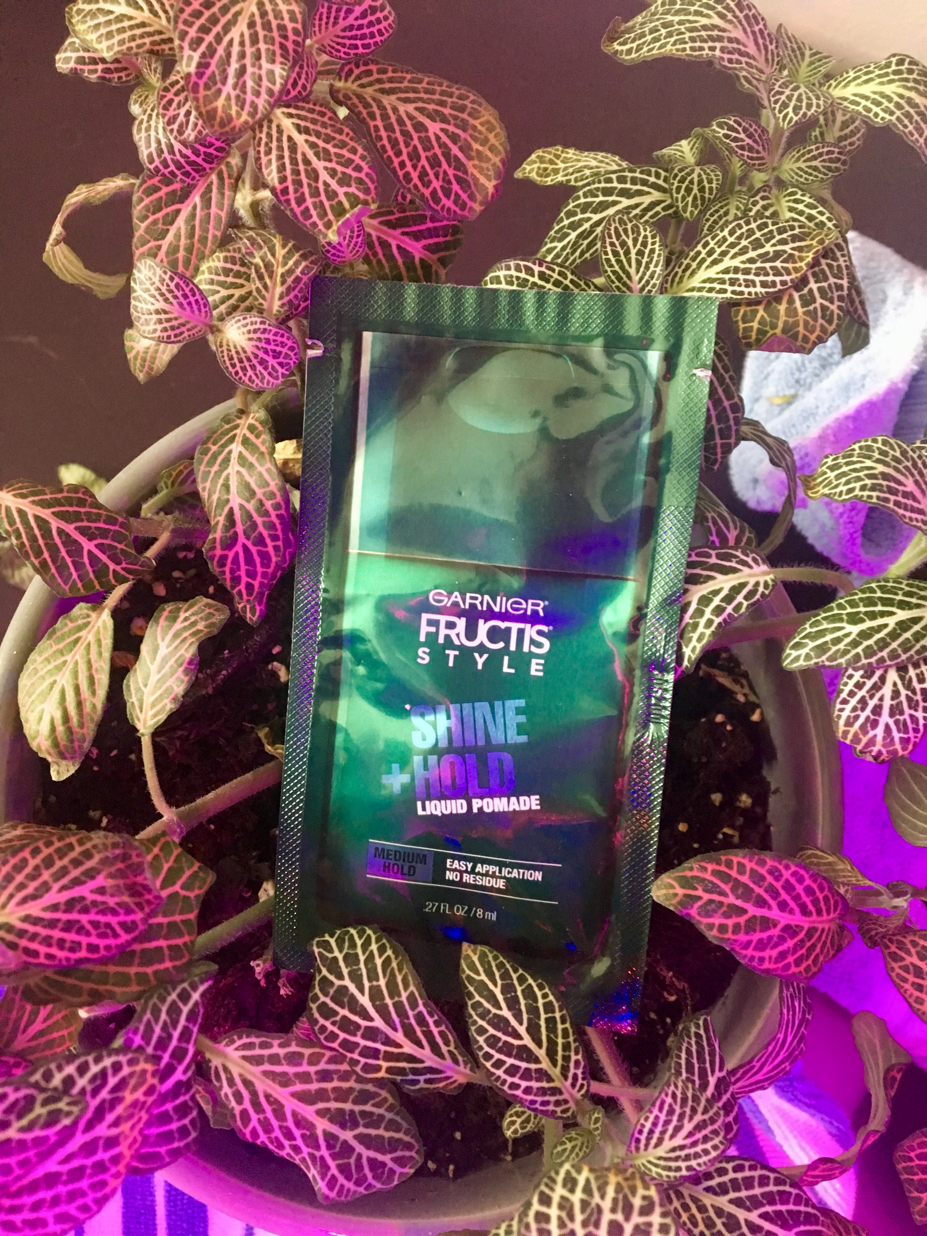 Garnier Fructis Liquid Pomade Sample in Leaves Background