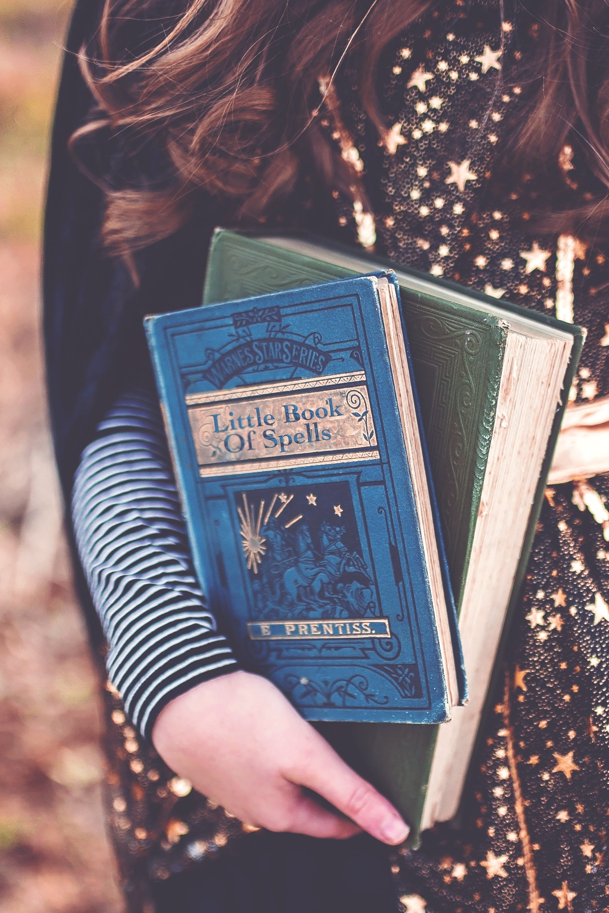 Witchy person holding spellbook