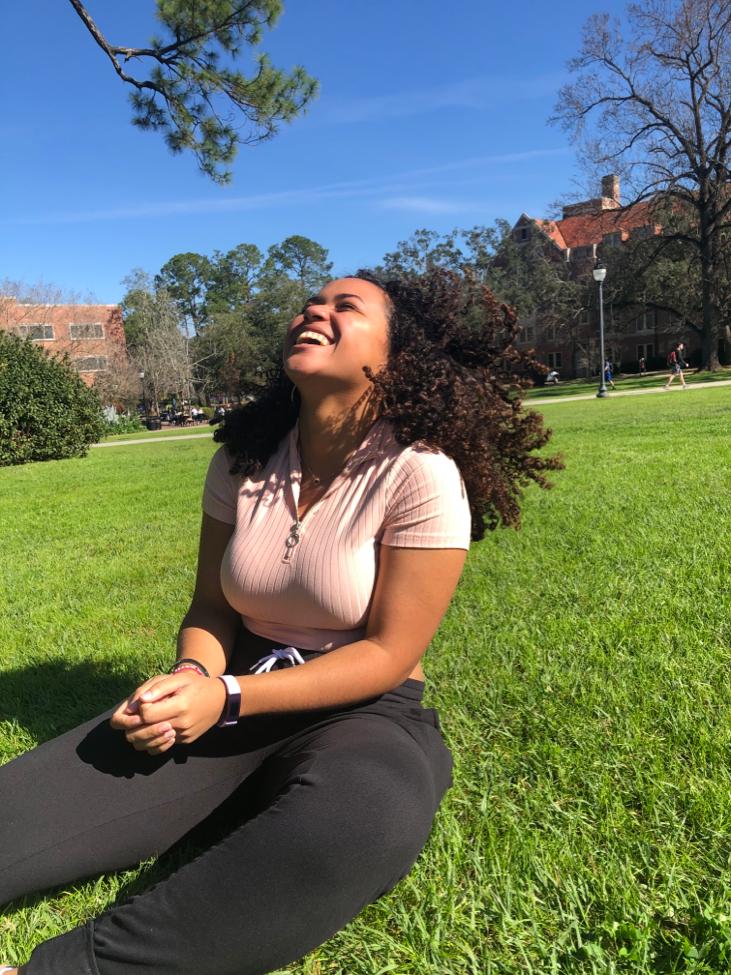 Gabriella Alexander laughing on lawn