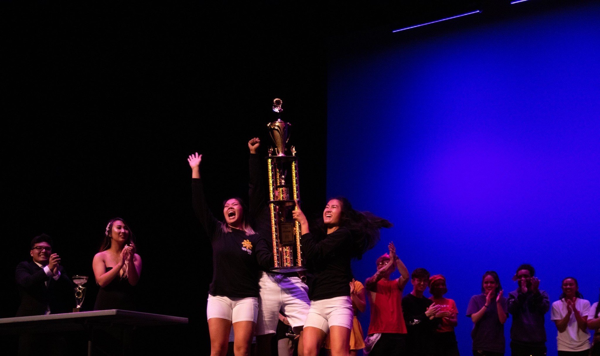 Amber holding up a trophy