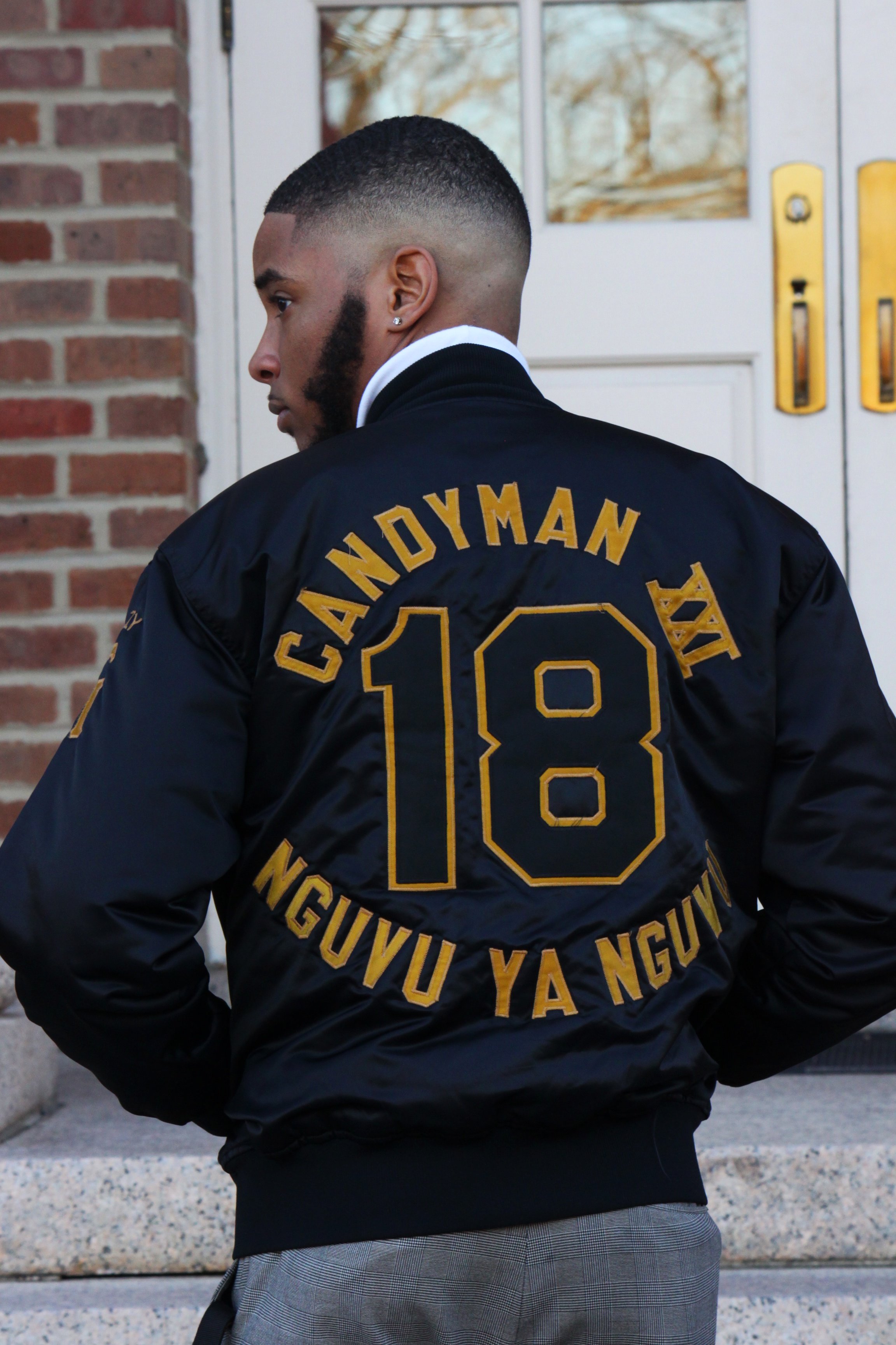 man is standing with his back to the camera