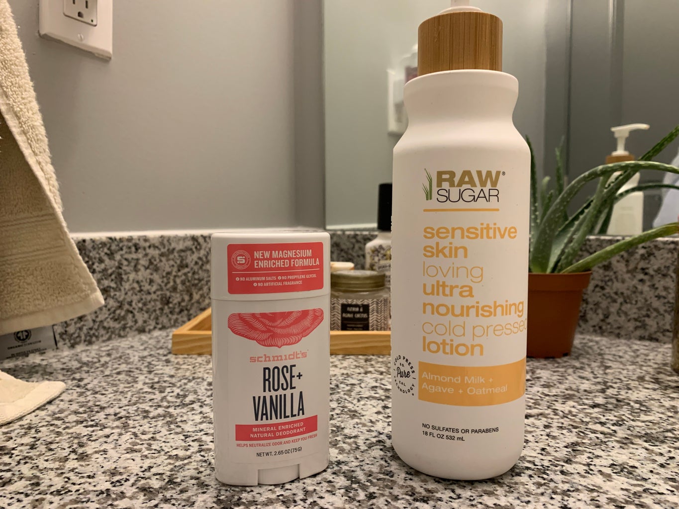 Deodorant and lotion bottles on bathroom counter