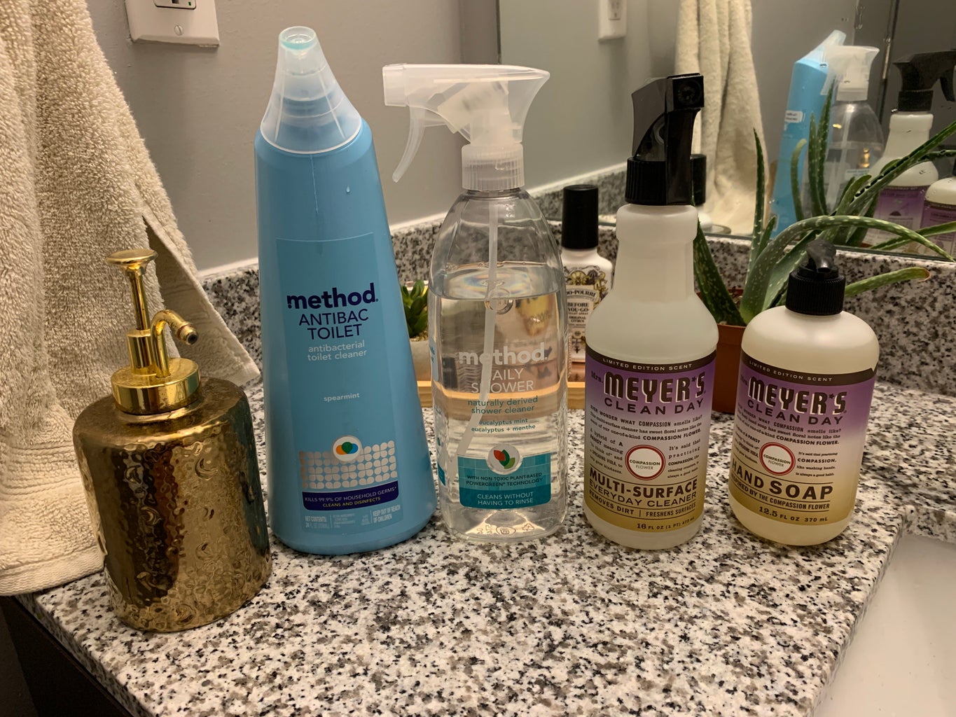 variety of cleaning products on bathroom sink