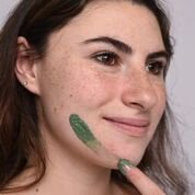 girl applying face mask