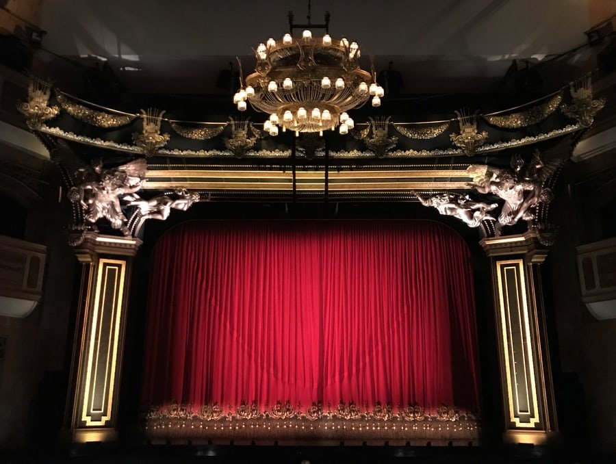 Red curtain in big theatre