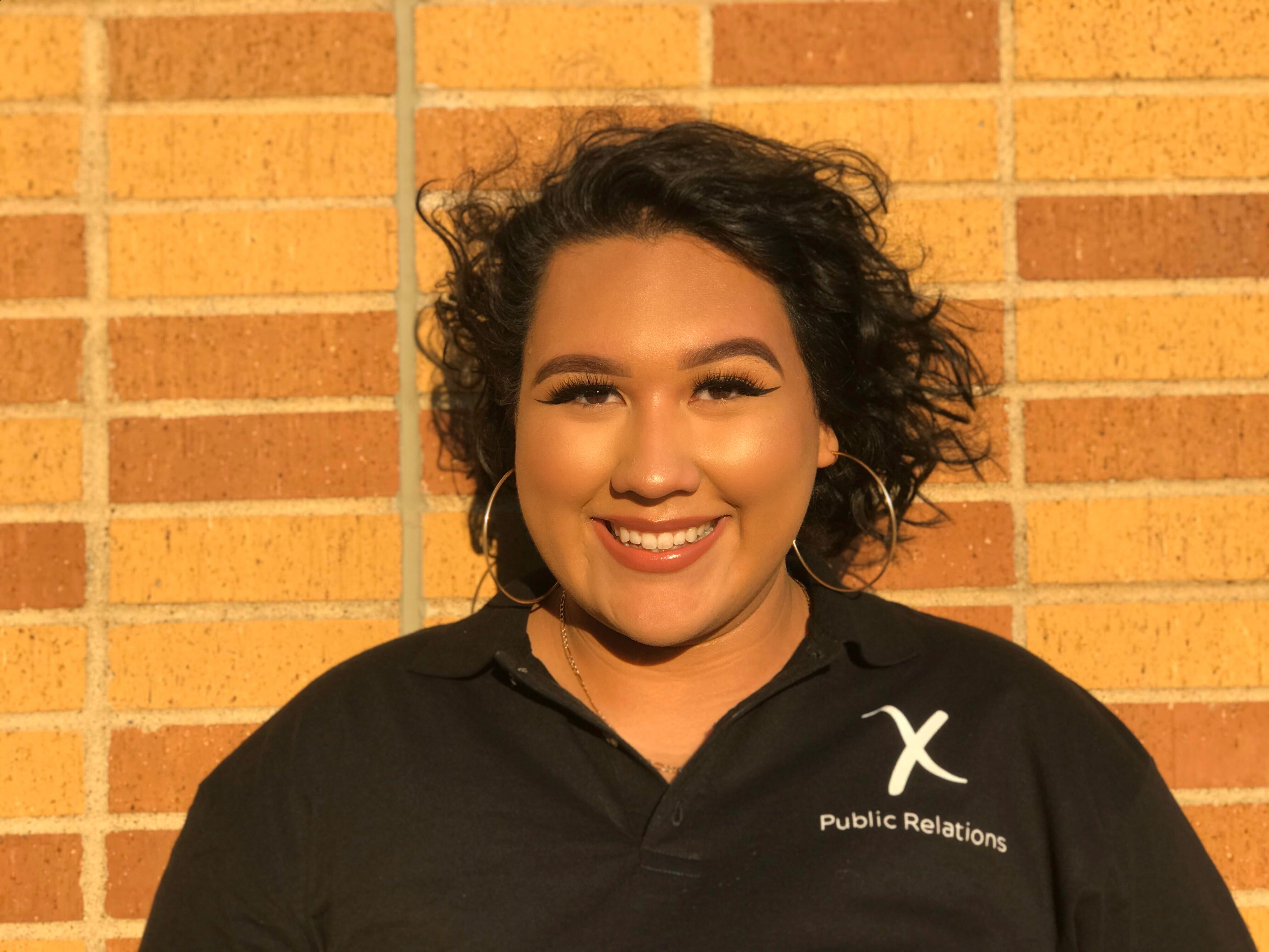 Alejandra Balbuena posing in pr uniform