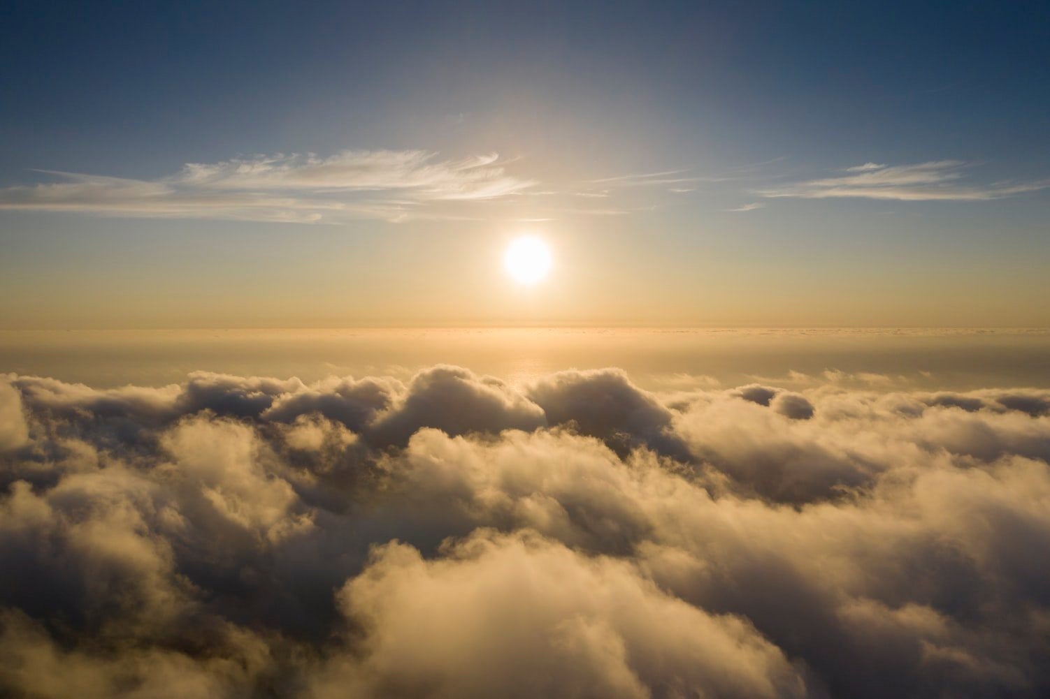 A bird\'s eye view of beautiful clouds and the sun