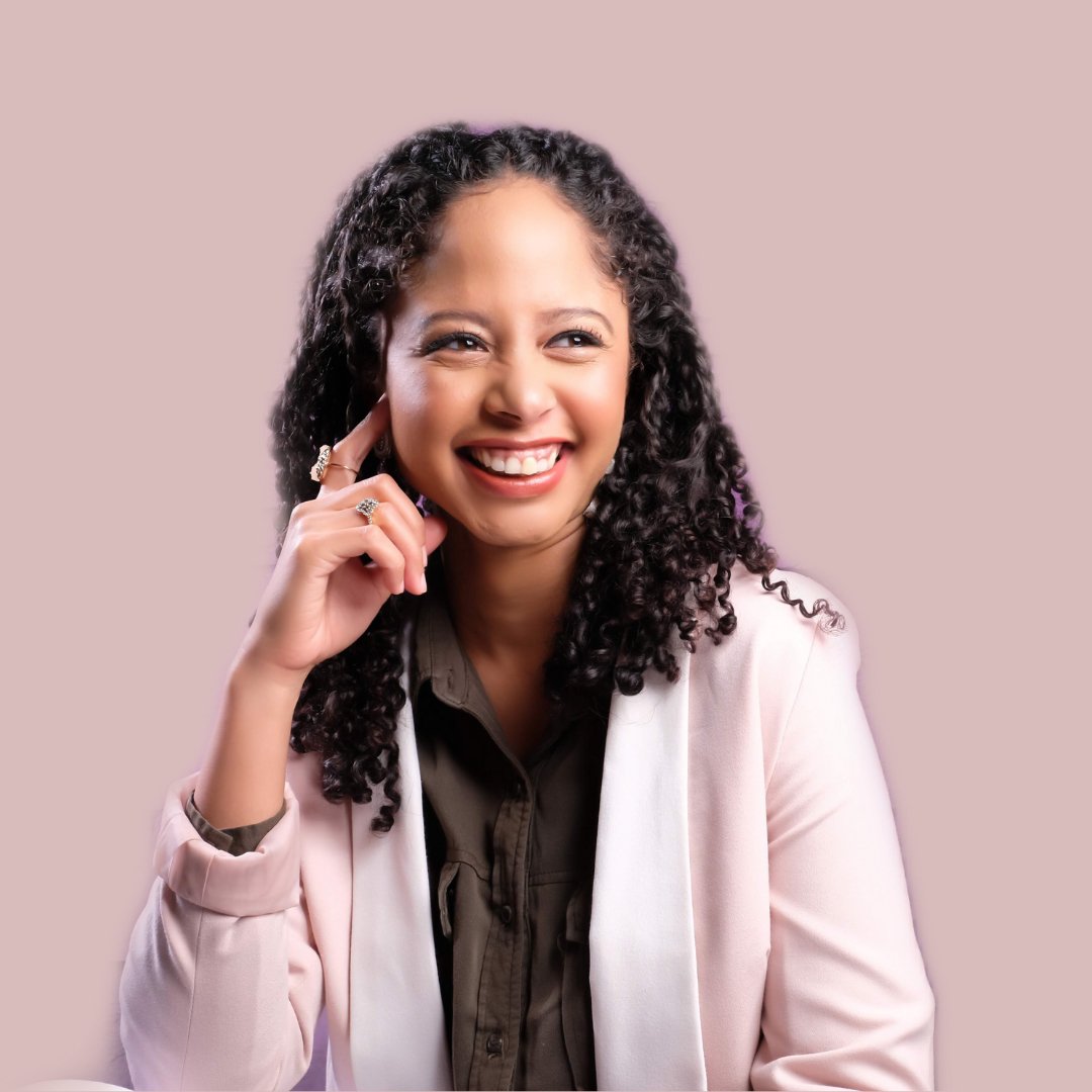 The image is a profile shot of Dr. Carmen James smiling.