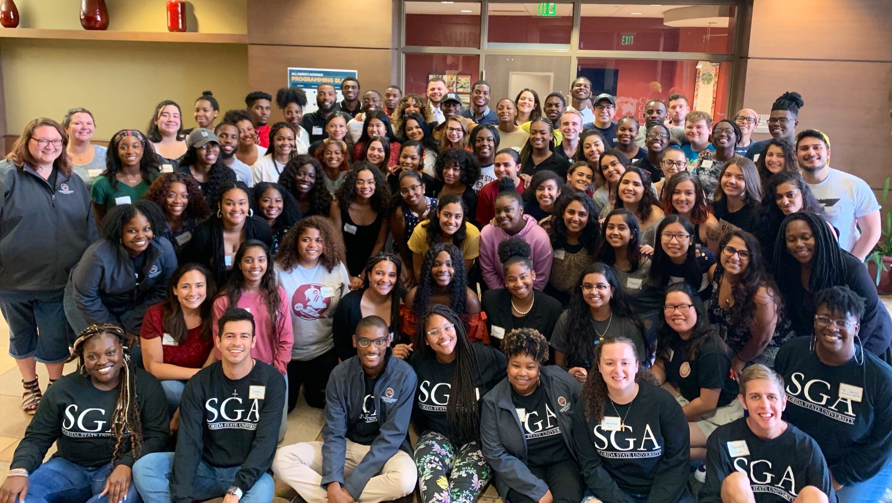 There are people wearing SGA shirts in the front. This picture was taken at SGA All-Agency Meeting