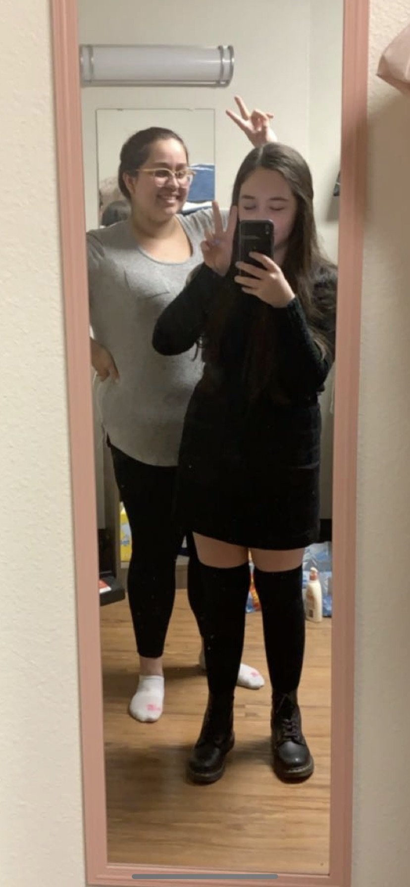 Girls taking photo together in winter clothing