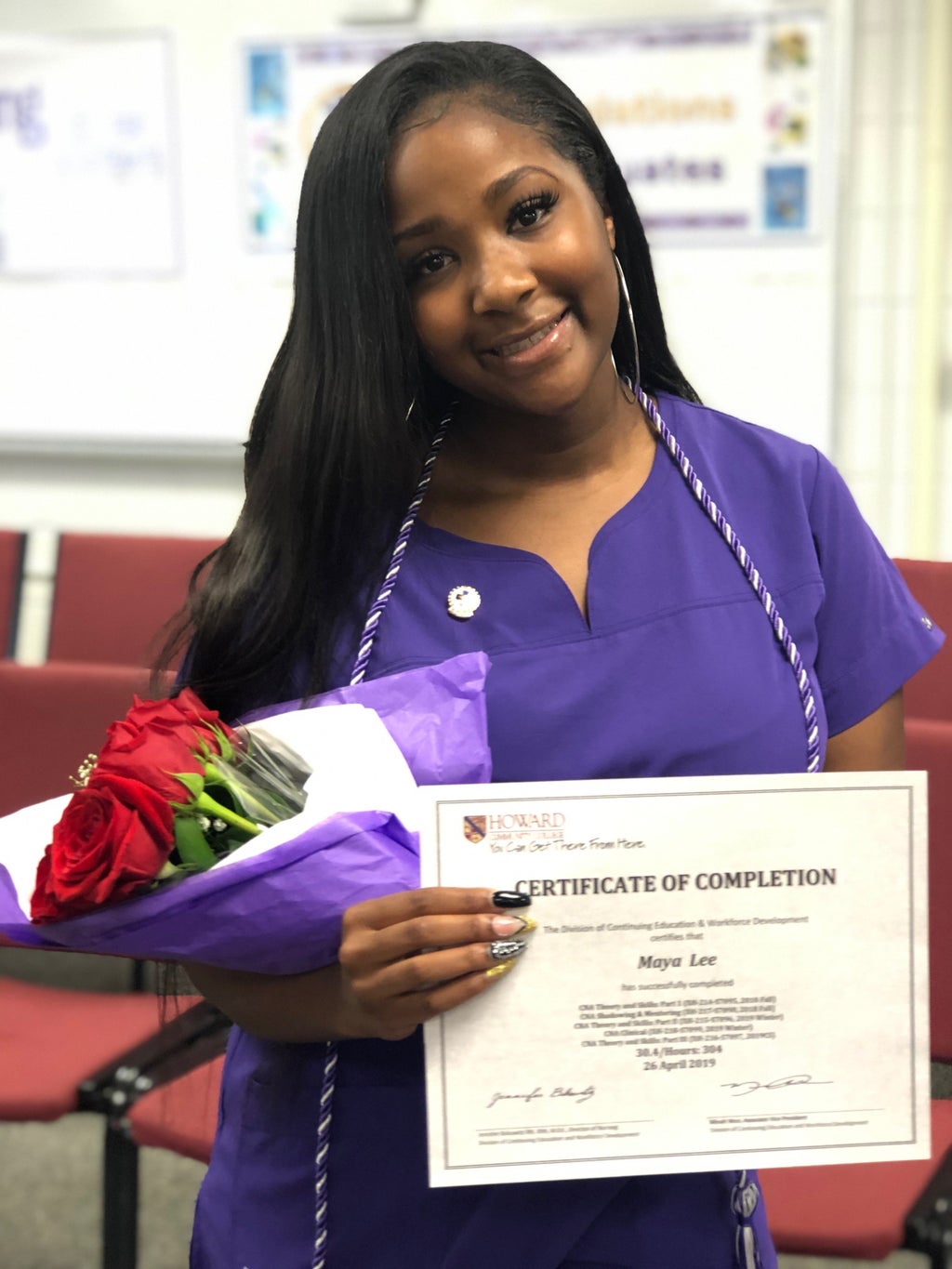Black girl receiving nursing certificate
