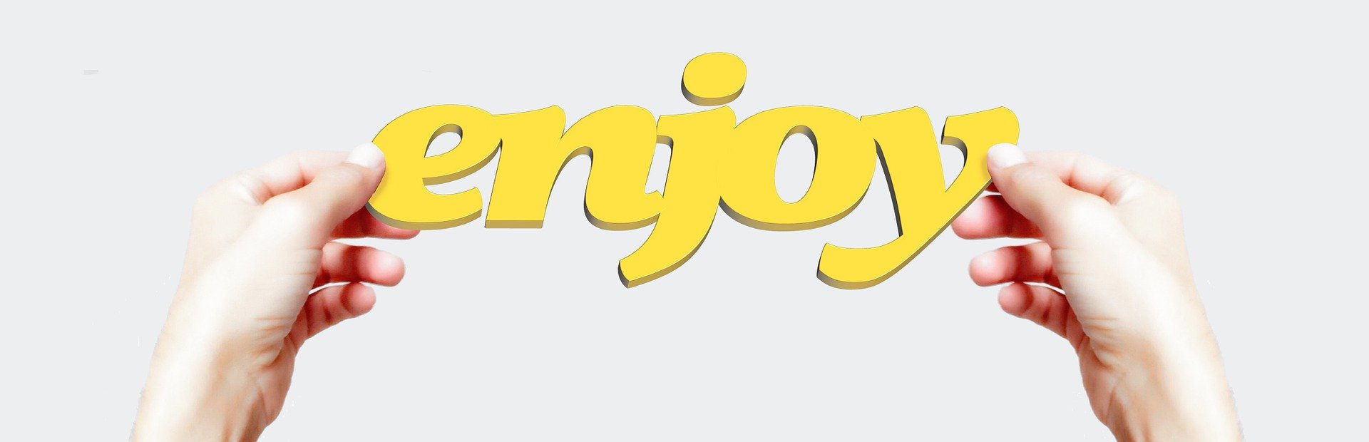 hands holding enjoy sign