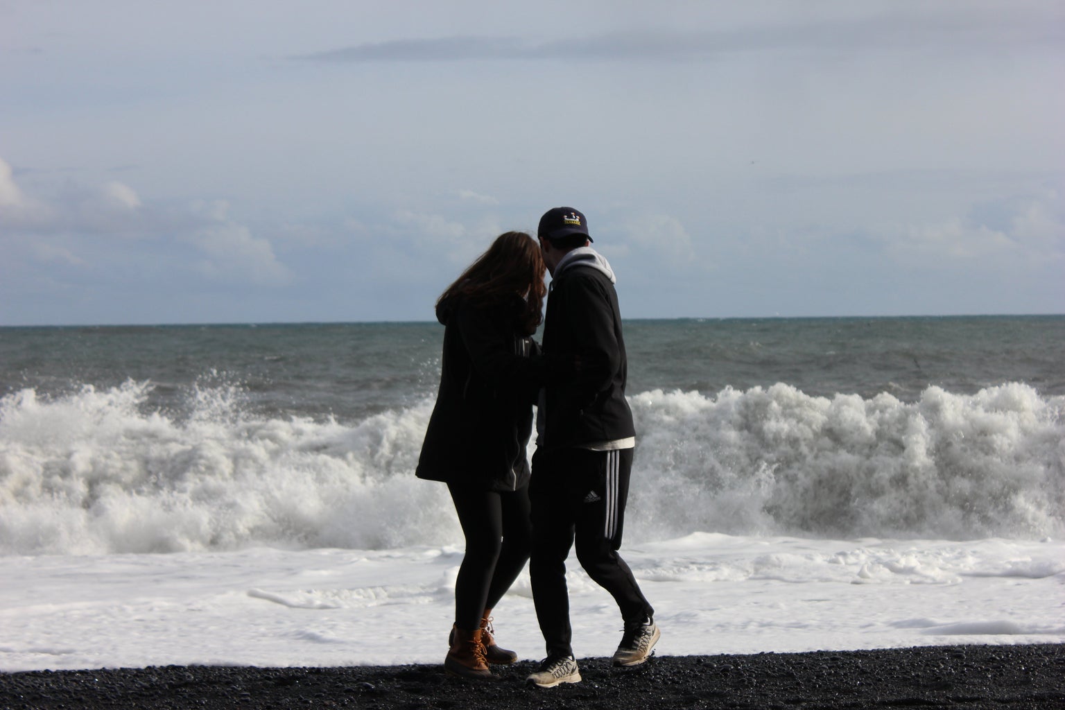 couple on black sand beach
