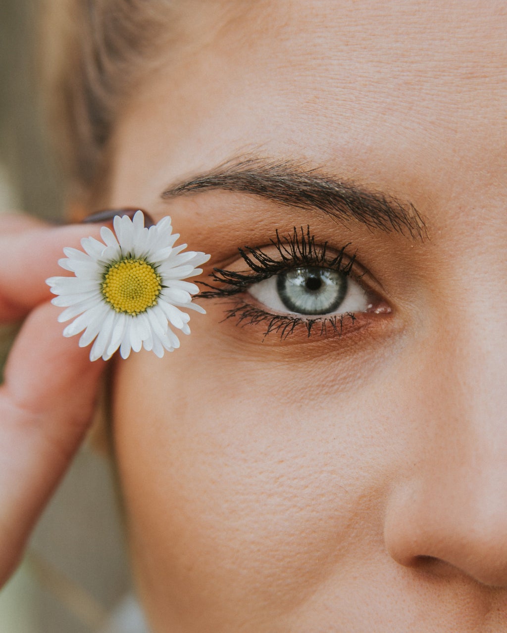 eye with a flower beside it