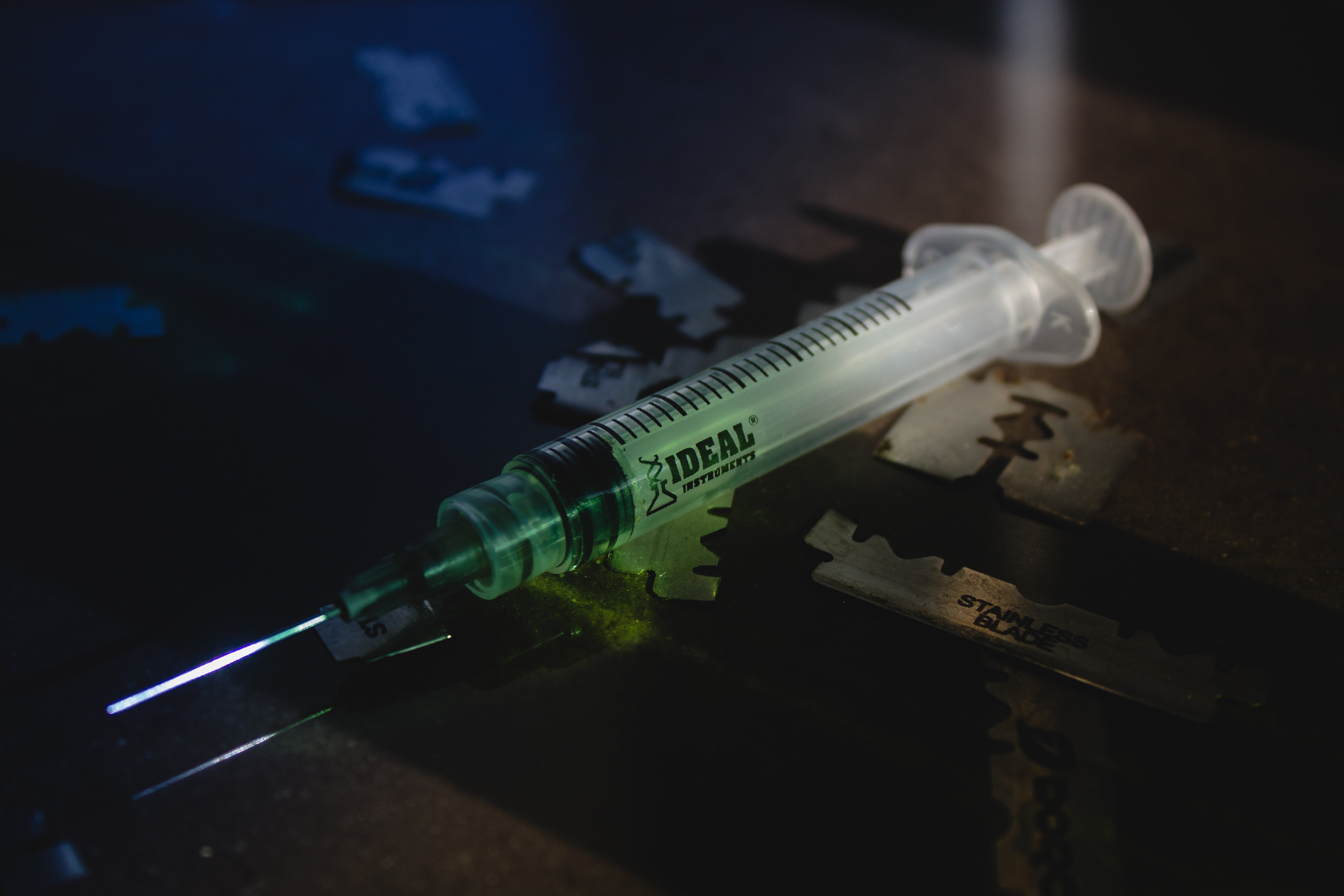 Syringe with green liquid
