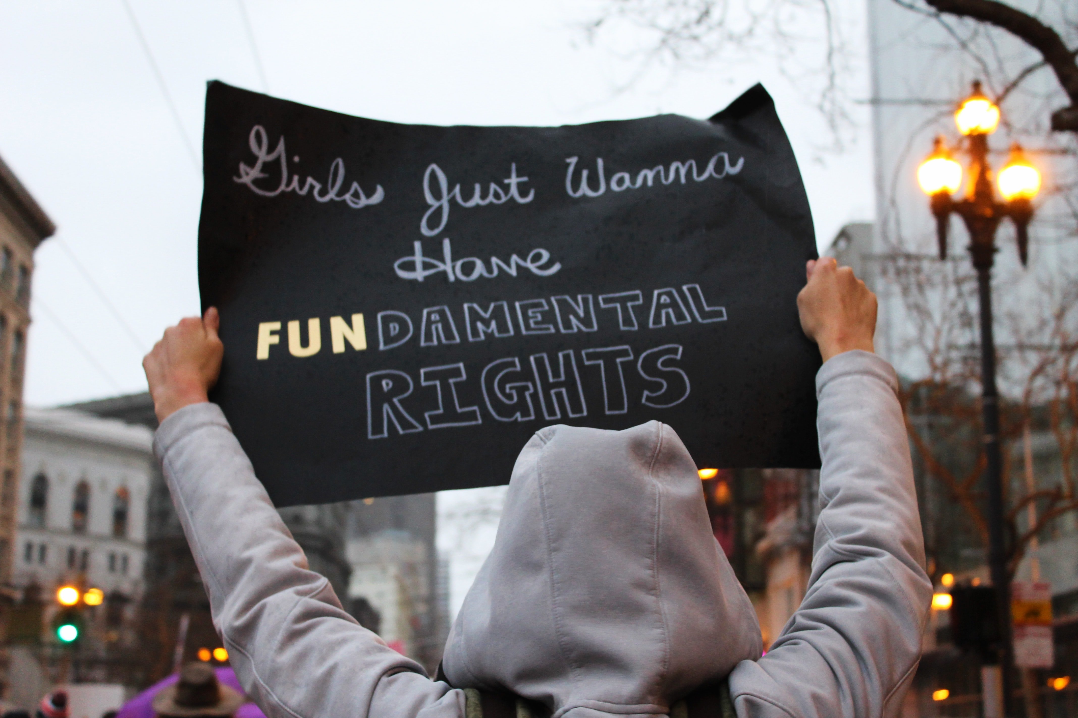 Feminist activist holding sign