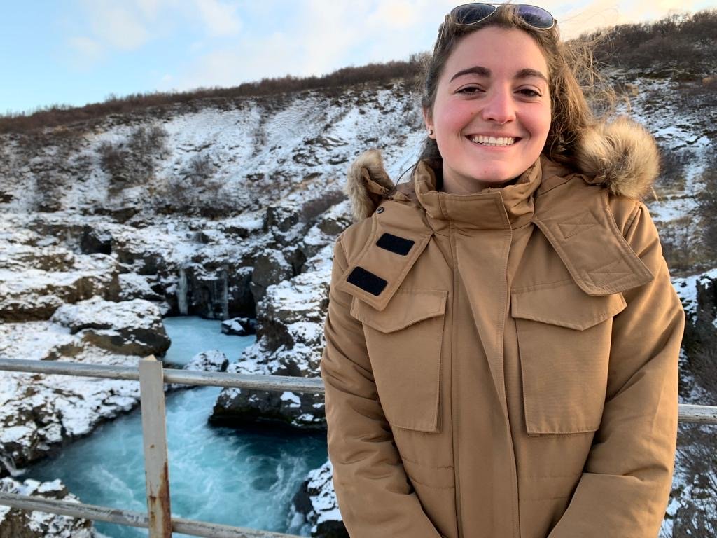 Zoe Dessoye in front of springs in Iceland.