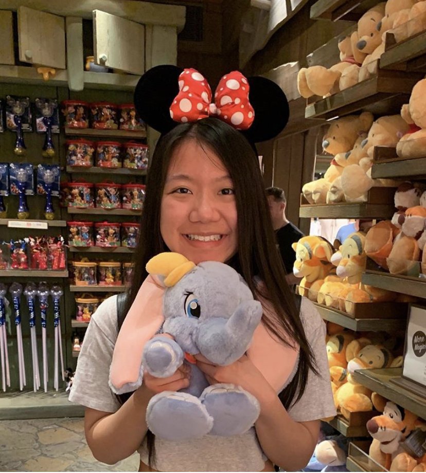 woman holding stuffed animal
