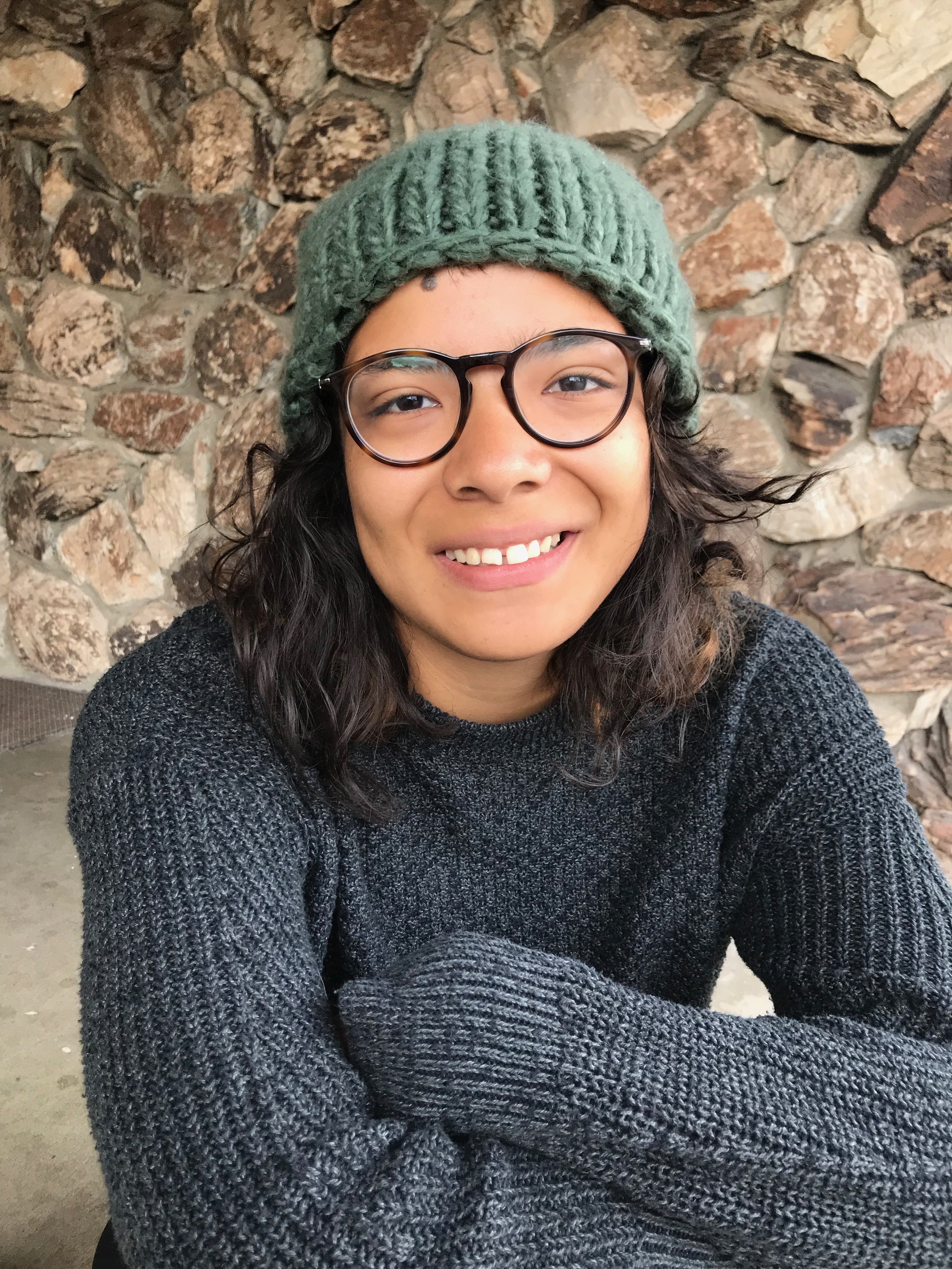 woman smiling with arms crossed
