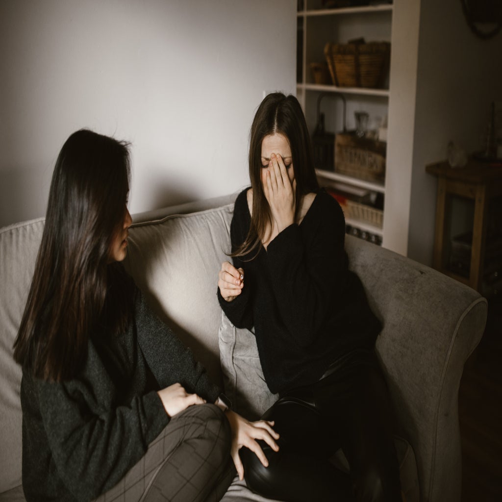 woman comforting her friend