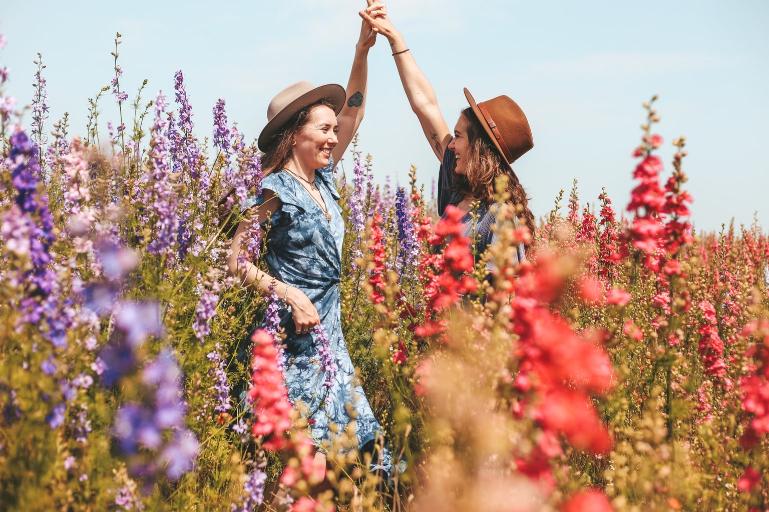 two girls in a field of flowers