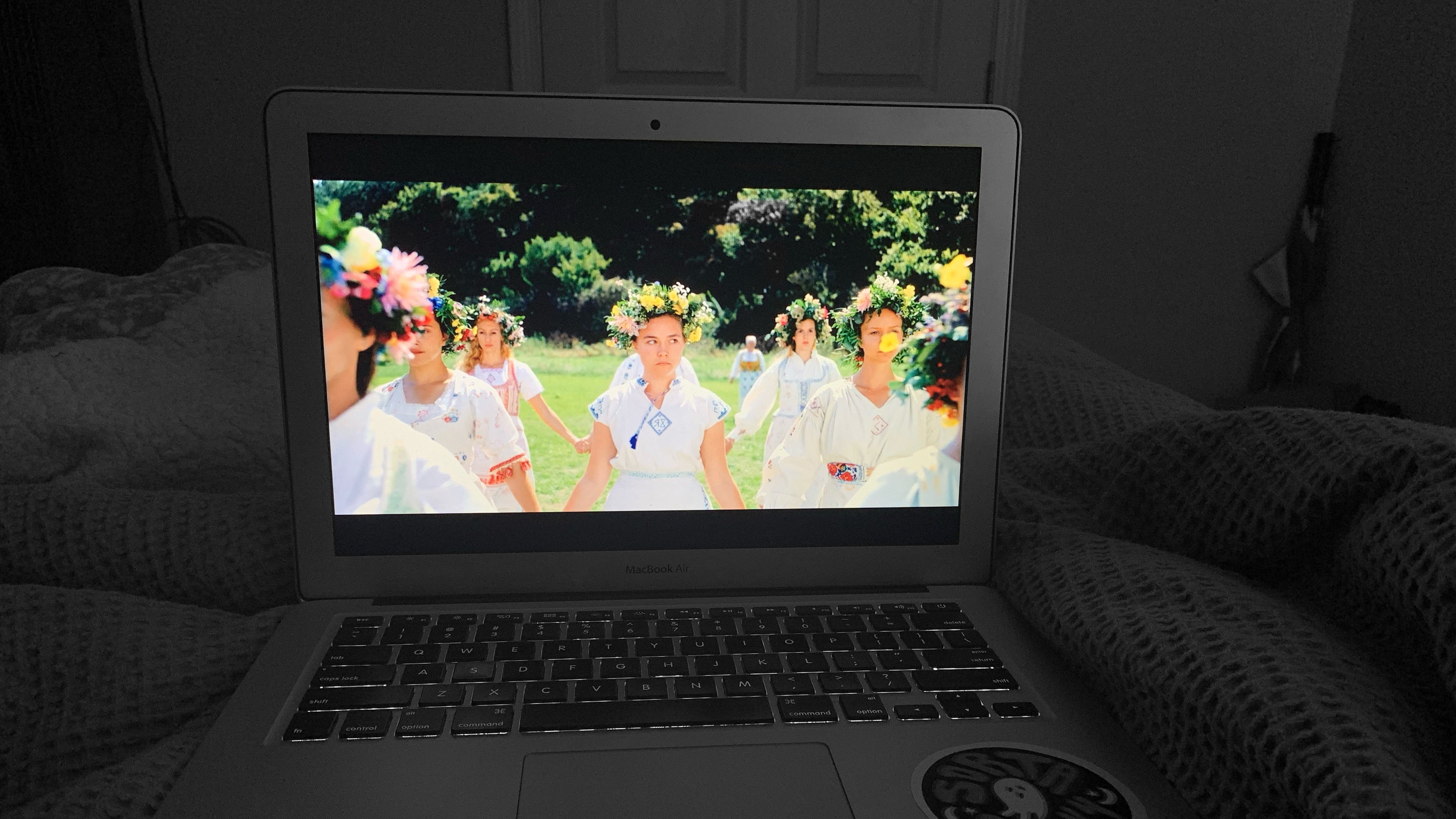 gray laptop with bright image flowers