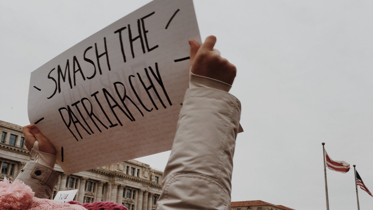Woman holding sign